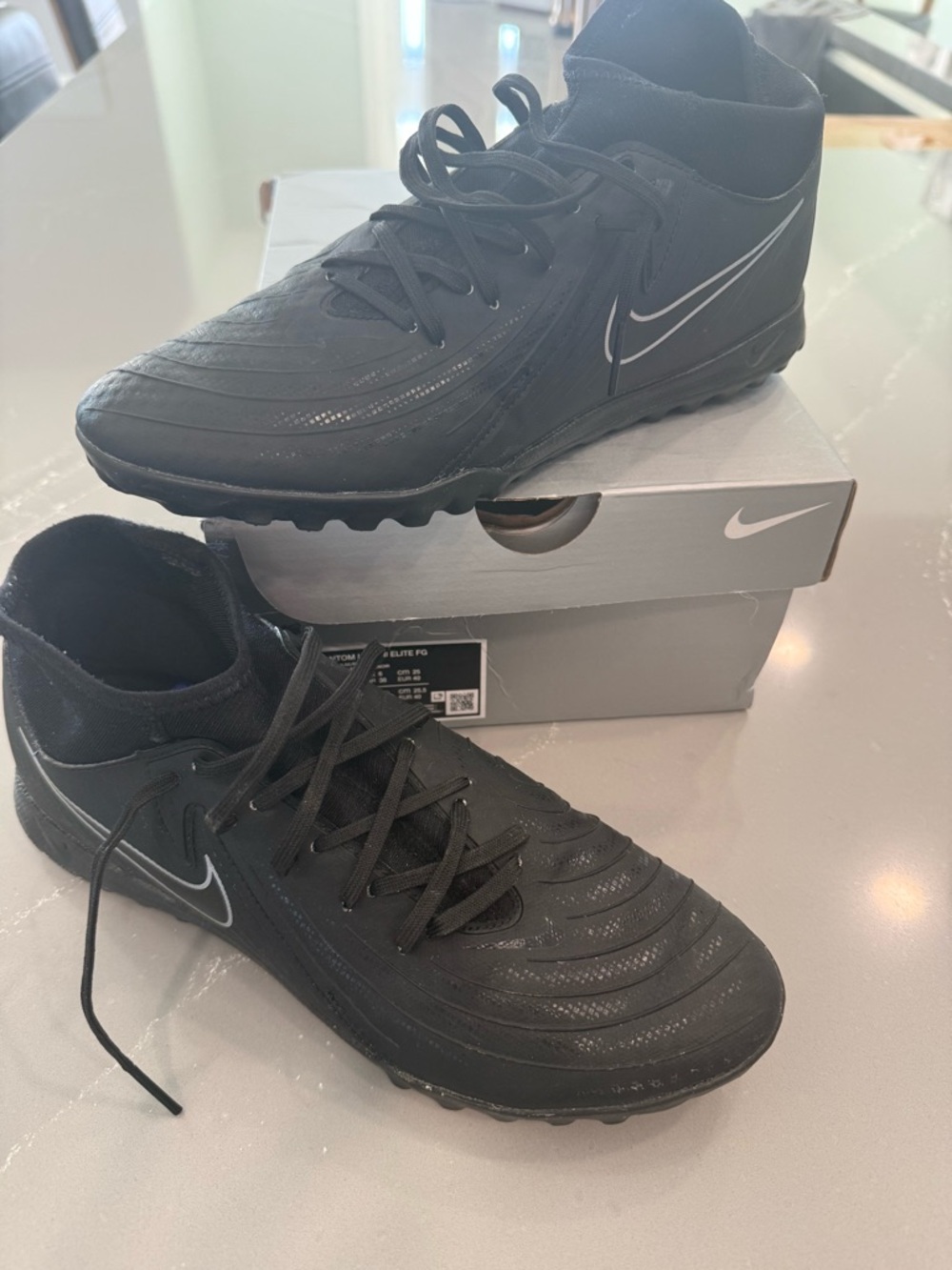 Nike Phantom Luna II Elite FG in Black with Sunset Pulse Accents Turf Cleats